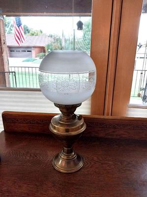ANTIQUE BRASS OIL LAMP WITH A GLASS GLOBE