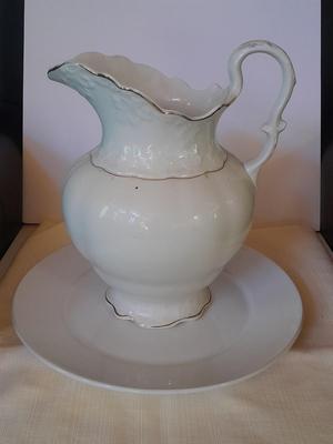 Large gold rimmed semiâ€“Vitreous Porcelain K.T. &M. pitcher on Dansk Platter