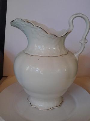 Large gold rimmed semiâ€“Vitreous Porcelain K.T. &M. pitcher on Dansk Platter