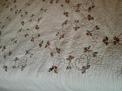King sized embroidered rose quilted bedspread.