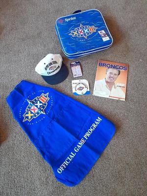 Bronco's collectible items from Superbowl and John Elway Seat cushion, Apron John Elway ticket stub