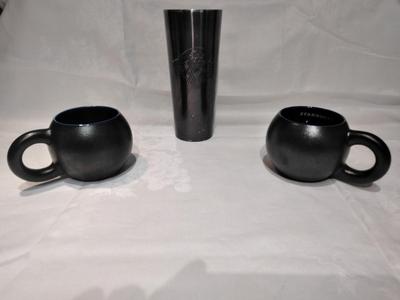 Three Starbucks mugs