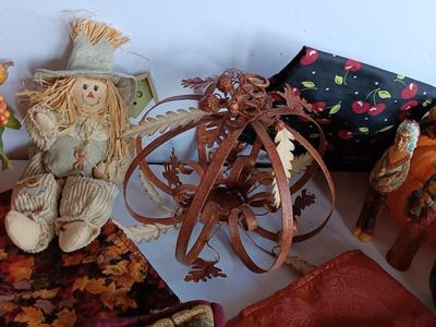 Fall Decorations for your home - pumpkins - scarecrow - tablecloth- miniature straw bales.
