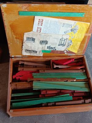 Vintage Lincoln logs in a wooden box with instructions
