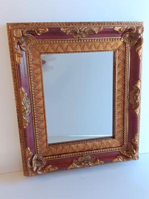 Gold and maroon decorative framed wall mirror with small shelf