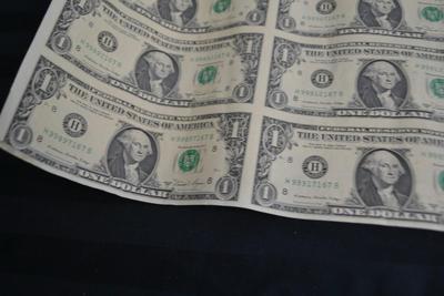 LOT 45. UNCUT SHEET OF  32 US ONE DOLLAR BILLS