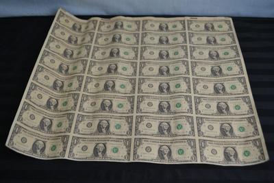 LOT 45. UNCUT SHEET OF  32 US ONE DOLLAR BILLS