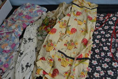 LOT 51 FOUR VINTAGE APRONS