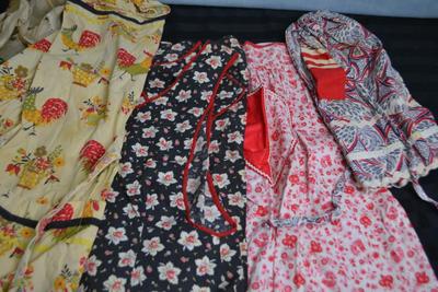 LOT 51 FOUR VINTAGE APRONS