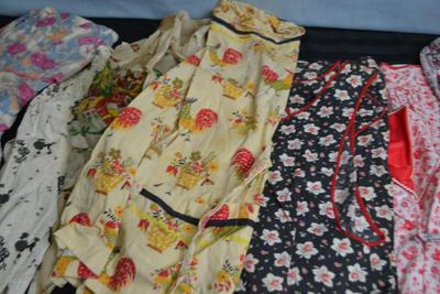 LOT 51 FOUR VINTAGE APRONS