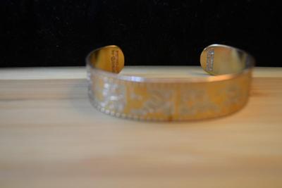 LOT 87 DISNEY COPPER BRACELET AND CHURCHILL BOOK MARK
