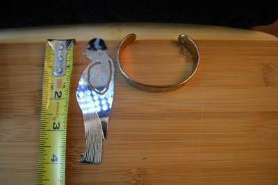 LOT 87 DISNEY COPPER BRACELET AND CHURCHILL BOOK MARK