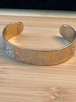 LOT 87 DISNEY COPPER BRACELET AND CHURCHILL BOOK MARK