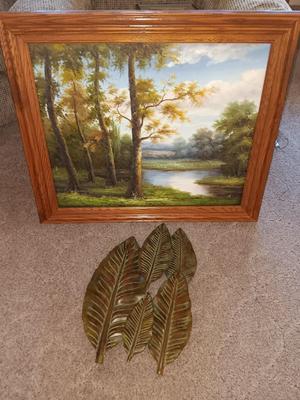 NICE FRAMED ARTWORK OF WOODS AND RIVER WITH METAL WALL ART LEAVES
