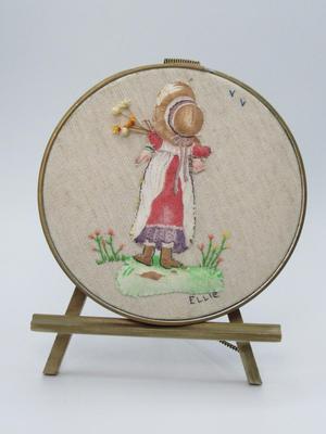 Vintage Ellie Originals Embroidered Girl Holding Flowers Displaying Craft Art with Small Easel