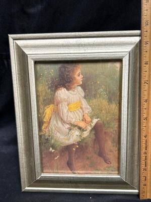 Framed Art Print Victorian Girl Sitting on Grassy Ledge