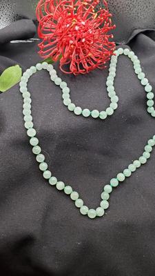Pale green jade necklace hand tied with green cording