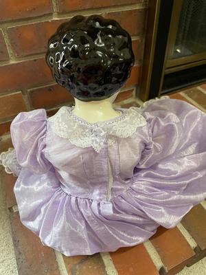 Ceramic doll with beautiful purple dress