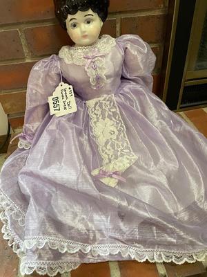 Ceramic doll with beautiful purple dress