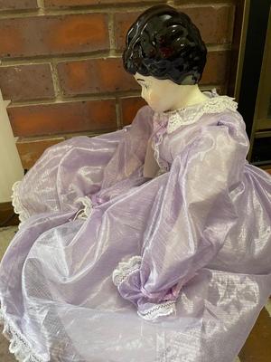 Ceramic doll with beautiful purple dress
