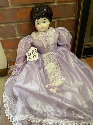 Ceramic doll with beautiful purple dress