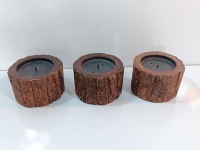Three rustic wooden pillar candle holders