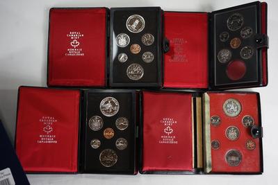 ROYAL CANADIAN MINT SETS (4) 1977, 1975, 1978, 1973 IN RED SATIN LINED PRESENTATION BOOKS,