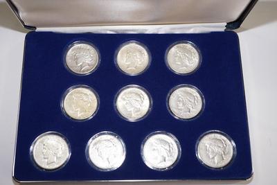 PEACE SILVER DOLLAR COLLECTION 1920'S /30'S  -TEN IN A PRESENTATION BOX & PLASTIC CASES.