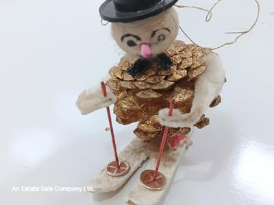 Antique pinecone Snow man skier