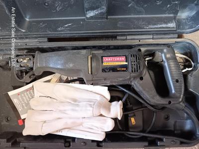 Craftsman Electric reciprocating saw in case with extra blades and gloves