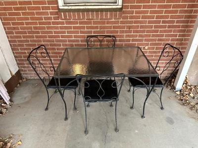 IRON FRAMED PATIO TABLE WITH GLASS TOP AND 4 IRON CHAIRS