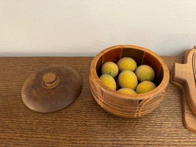 FAUX FRUIT IN A WOODEN LOKE BOWL, FOLDING WOOD BASKET AND MORE