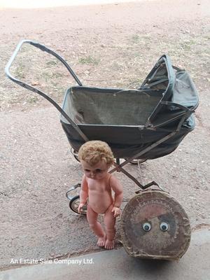 Vintage toy buggy stroller with baby doll and luggage of doll clothes