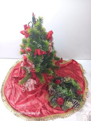 Faux Christmas tree with ornaments and bows - tree skirt and Plastic greenery