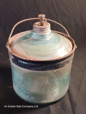 Antique glass kerosene jug by Cleveland Metal Products