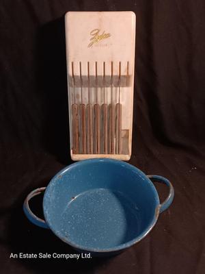 Blue enamelware dish with a set of vintage Zylco Freeze knives in a hanging bakelite case