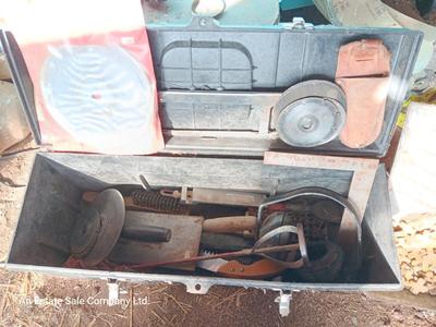 Black plastic toolbox with an assortment of tools