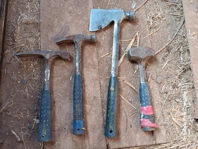 Four Ewing hand tools - hatchet - rock pick - sledgehammer - hammer