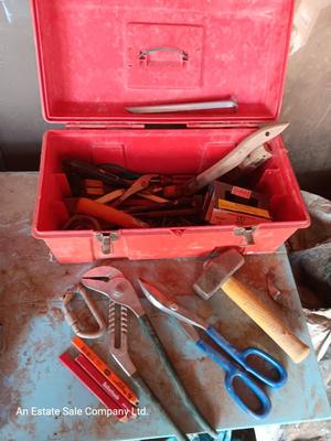 Red plastic toolbox with a variety of tools
