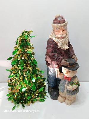 Large Santa building a snowman with plastic tinsel tree