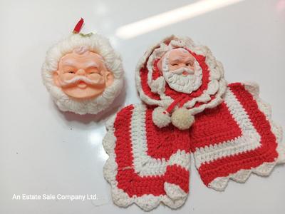 Two vintage rubber Santa face collectibles - ornament and crocheted hot pads