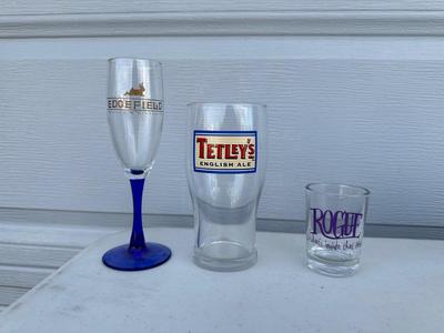 AN ASSORTMENT OF BEER GLASSES FROM VARIOUS BREWERIES