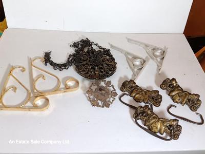 Vintage hardware for cabnitry with shelf hardware and a plastic decorative hanger