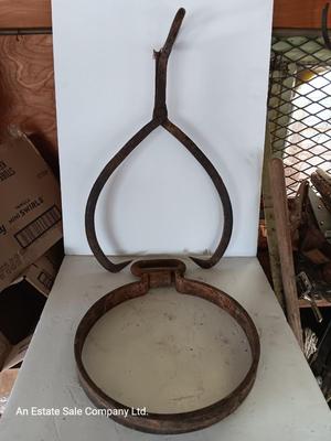 old antique iron tongs, primitive vintage farm icehouse block and steel ring with a handle