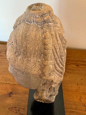 Sandstone Buddha head on pedestal, India, c. 16th-17th Century