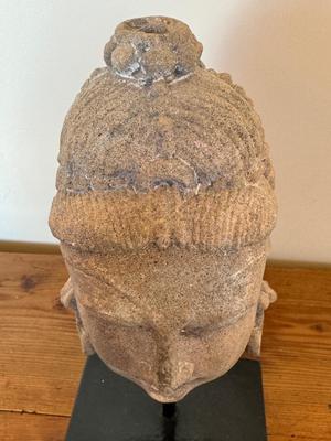 Sandstone Buddha head on pedestal, India, c. 16th-17th Century