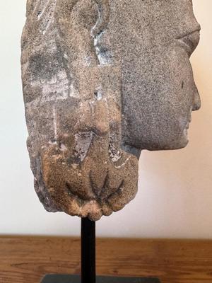 Sandstone Buddha head on pedestal, India, c. 16th-17th Century