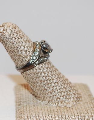 3 Prong Clear Faceted Stone with 14 Stones in a Neck-Wrap Style Surround Size 7 1/4