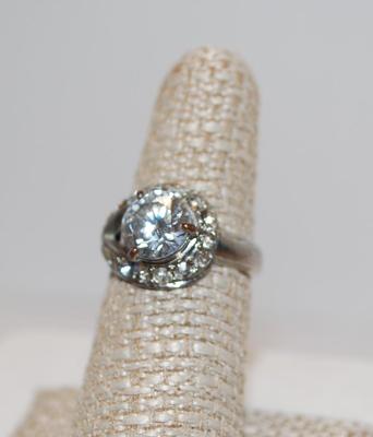 3 Prong Clear Faceted Stone with 14 Stones in a Neck-Wrap Style Surround Size 7 1/4