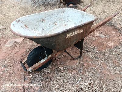 Steel framed wheelbarrow with metal handles